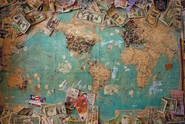 Bank notes on world map